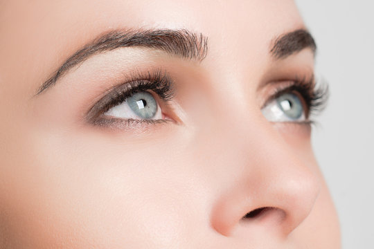 Closeup Staring Female Blue Eyes With Long Lashes