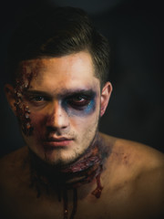 Halloween guy with blood and wounds