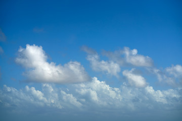 Naklejka na ściany i meble Blue summer sky white cumulus clouds