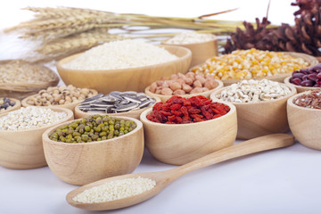 Cereal grains , seeds, beans on wooden background