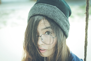 Portrait headshot of Young asian hipster woman wearing glasses 