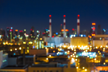Defocused Night Cityscape with Chimneys