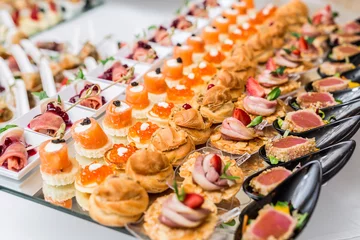 Fotobehang Gourmet appetizers: caviar, venison, tuna and salmon. © volff