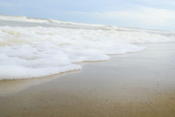 Wave of the sea on the sand beach
