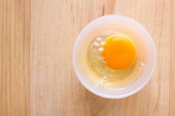 Fresh eggs in a cup