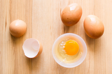Fresh eggs in a cup and egg shell