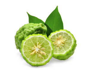 Fototapeta na wymiar whole and half of green fresh bergamot with green leaves isolated on white background