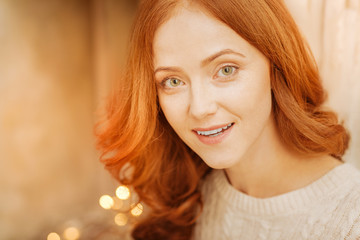 Close up look on portrait of excited redhead woman
