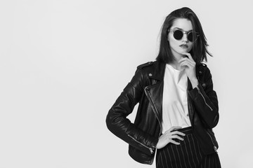Young beautiful woman in a black jacket. Black and white image