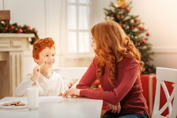 Positive minded family writing letter to santa claus
