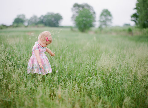 Girl playing in a open filed