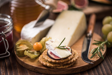 Cheese crackers with camembert,honey,fig and herb