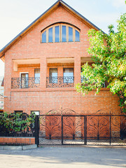 Red brick house, front view. Russia.