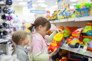 Two sisters in   toy store