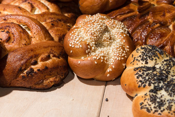 Different bakery products on a wooden background