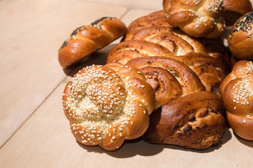 Different bakery products on a wooden background