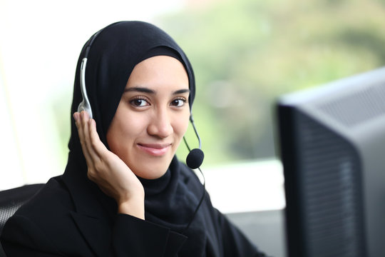 Beautiful muslim business woman smiling at camera