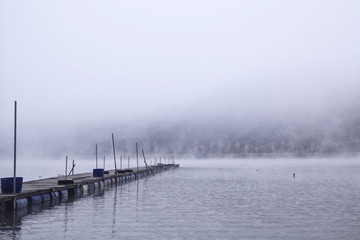 Obraz premium Landscape of MunGwang Reservoir with early morning fog, Chungcheongbuk-do Province Goesan, South Korea