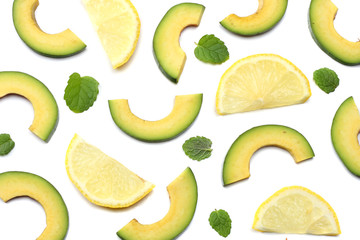 healthy food. sliced avocado isolated on white background. top view
