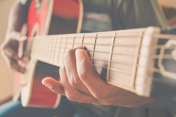 Playing Acoustic guitar