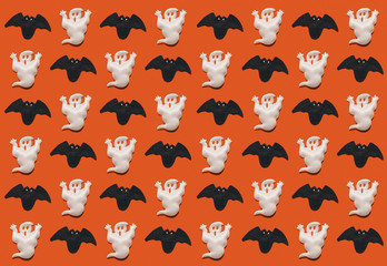 Halloween pattern; black bats and white ghosts on a bright orange background
