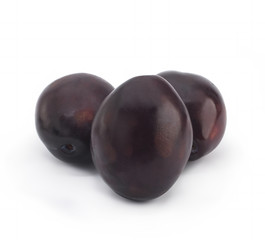 Plums on white background