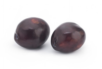 Plums on white background