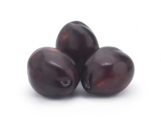 Plums on white background