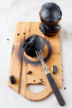 burned muffins - black cupcakes, failed baking, catastrophe in the kitchen, burned on charcoal