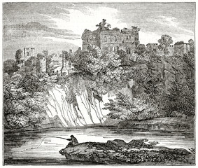 Old grayscale illustration of a fortress ruins on a rock in the deep nature. Chepstow castle, England. By unidentified author, published on  Penny Magazine, London, 1835