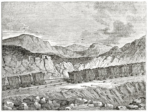 Old grayscale illustration of old mine carts over their rails on the rocks. South Hetton colliery. Coal railway. United Kingdom. By unidentified author, published on  Penny Magazine, London, 1835
