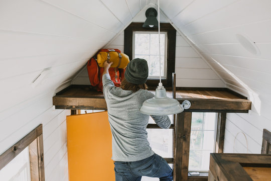 guy reaching in tiny house