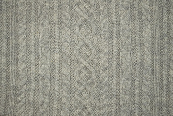 background knitted fabric with braids.  Knitted Wool Background.
