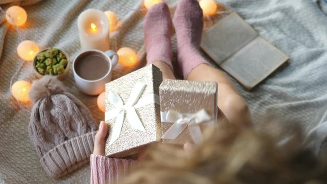 Happy Woman In Cosy Winter Socks With Christmas Gifts. Slow Motion. 4K. 