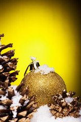 Christmas composition of Christmas tree toys on a yellow background