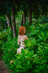 Young fashion woman relax on the beach. Happy island lifestyle. White sand, blue cloudy sky and crystal sea of tropical beach. Vacation at Paradise. Ocean beach relax, travel to Thailand, Krabi