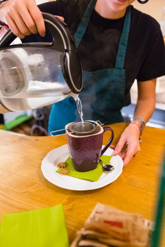 Preparing a Cup of Hot Tea in a Cafe