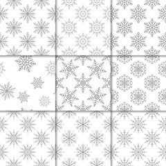 Set of snowflakes seamless patterns. Light gray and white backgrounds for wallpapers and textile