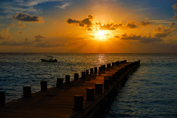 Riviera Maya pier sunrise in Caribbean Mayan