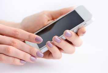 Women's hands holding mobile phone