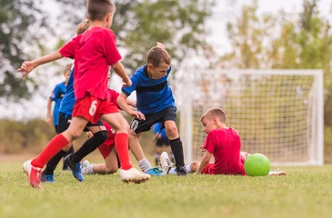 Foto op Canvas Kids soccer football - children players match on soccer field © Dusan Kostic
