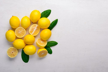 Fresh lemons. On a wooden background. Top view. Free space for your text.