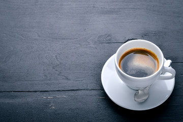 Espresso coffee On a wooden background. Top view. Free space for your text.