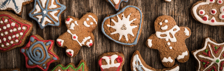 Colorfully Christmas cookies on rustic wooden background