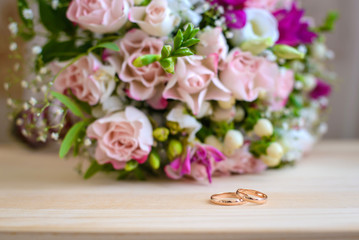 Engagement rings and wedding bouquet
