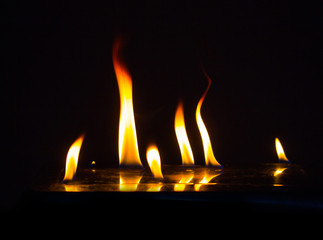 Burning fire on black background.