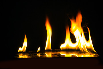 Burning fire on black background.