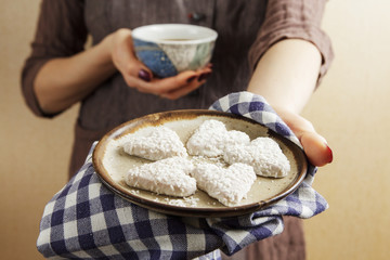 Strong espresso cup of coffee and biscuits in the shape of a heart, St.Valentine's Day concept