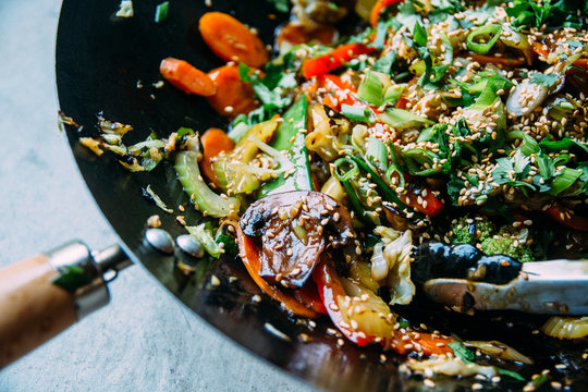 Vegetable Stir Fry In A Wok With Sesame Seeds Topping