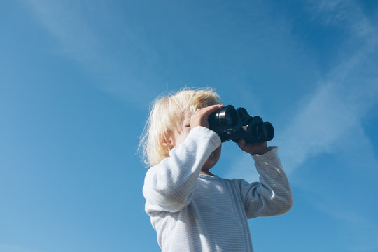 Toddler with binoculars